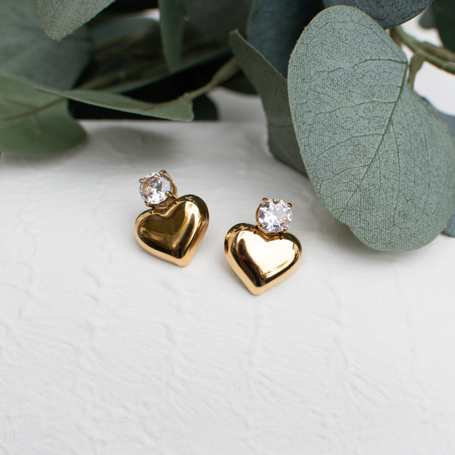 Gold heart-shaped stud earrings with sparkling crystal from the Galentine Collection.