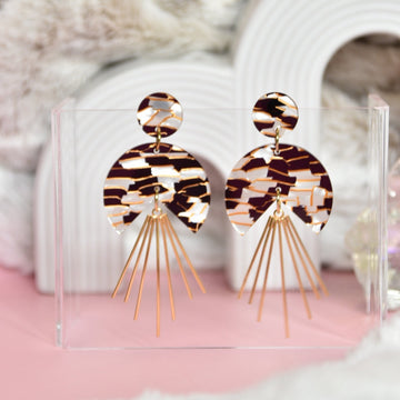 Bold statement flair earrings adorned with gold radiant spikes