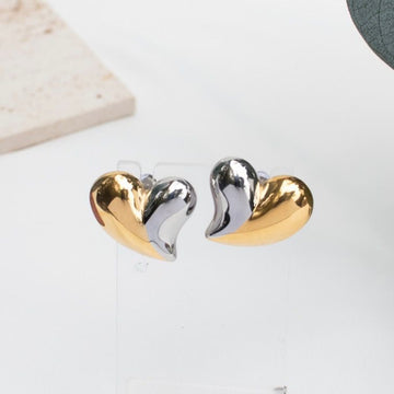 Two-tone heart-shaped earrings in silver and gold from the Galentine Collection.