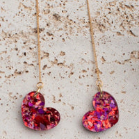 Vibrant heart-shaped earrings with pink and red mosaic design on a gold chain from the Galentine Collection.